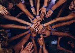 Photo of a bunch of hands coming together as a symbolism of corporate responsibility